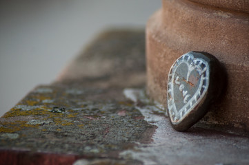 closeup of stoned in shaped heart on stoned wall in outdoor - Love concept
