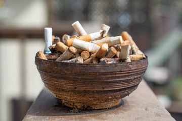 Cigarette butts and ashtray.
