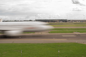 Motion blurred passenger aircraft quickly rushing by