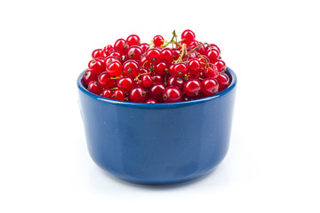 Fresh currant on plate on Isolated white background. Berries