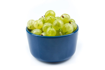 Fresh gooseberries on plate on Isolated white background. Berries