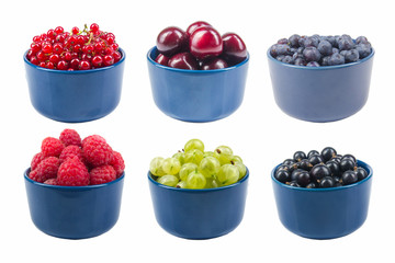Berries on Isolated white background, bowl of Cherry, currant, blueberries, gooseberries, raspberries, blackberries, strawberries, apricots.