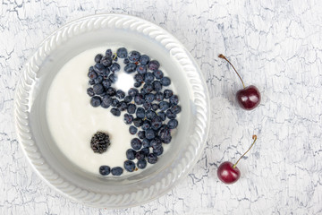 Fresh ripe berry in closeup on white wooden background. Berries