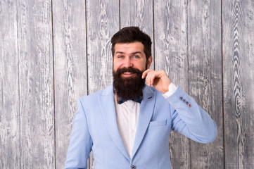 Beard and mustache. Barber shop concept. Guy well groomed handsome bearded hipster wear tuxedo. Gentleman style barber. Barber shop offer range of packages for groom make his big day unforgettable