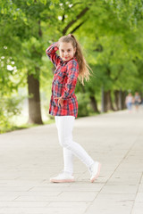 Fototapeta premium Hairstyles to wear on windy days. Windproof hairstyles. Girl little cute child enjoy walk on windy day nature background. Feeling cozy and comfortable on windy day. Deal with long hair on windy day