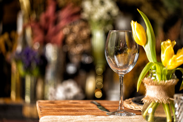 Naklejka na ściany i meble Gorgeous luxury wedding table. Detail of tulip and wine glass on table.