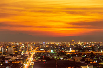 Bangkok nightscape, dramatic fiery sky and clouds