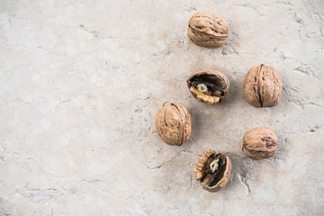 Delicious walnut on stone plate broken hard shell.