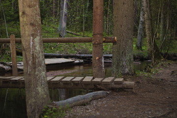 Wooden bridge over the river on a sports tourist route.