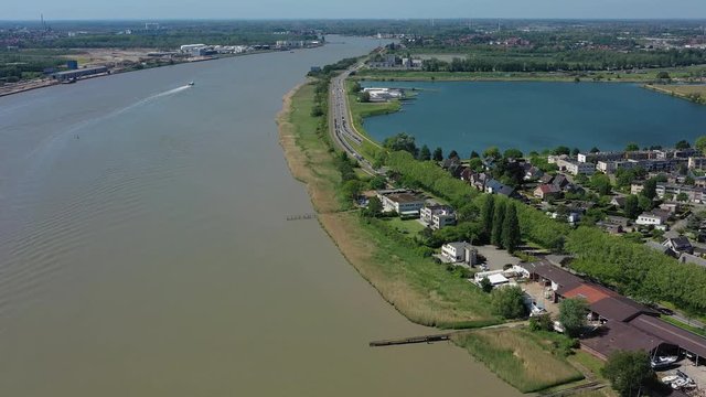 Aerial view of cityscape of Antwerp, modern part of city, residential areas and river Scheldt - landscape panorama of Belgium from above, Europe
