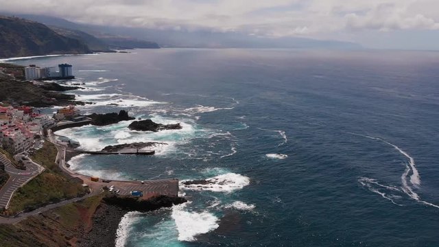Drone video - long coastline to the horizon, El Pris, Tenerife, Canary Islands, Spain