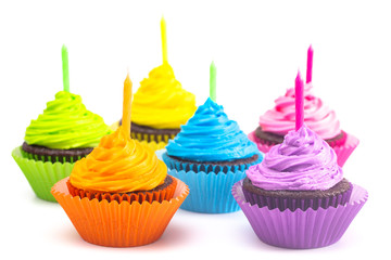 Rainbow Colored Frosted Chocolate Cupcakes on a White Background