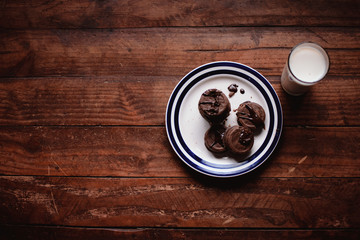 cup of coffee on wooden background milk coockies caramel