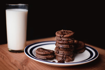 cup of coffee and cookies on wooden table