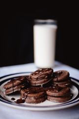 cup of coffee and cookies on white background
