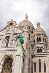 Fototapeta na wymiar Paris, France - APRIL 8, 2019: View of Sacre Coeur Basilica on a cloudy day. Basilica of Sacred Heart. Paris, France