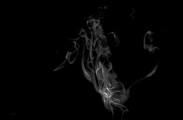 colored smoke isolated on black background horse shaped