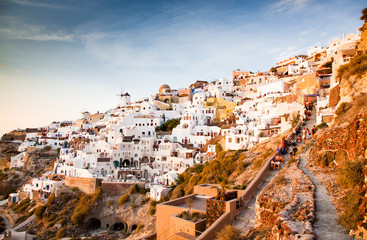 impressive evening view of Santorini island. Picturesque spring sunset on the famous Greek resort Oia, Greece, Europe. Traveling concept background.