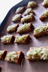 black bread croutons, cheese with spices. toast on the stove