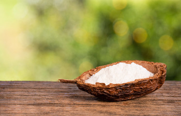 Baking soda, Sodium bicarbonate. Wooden table in the park among the trees on a summer day. Text...