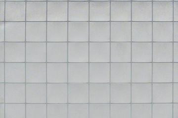 Background of the ceiling trim panels in the office. The texture of a standard panel ceiling in a building of flat squares.