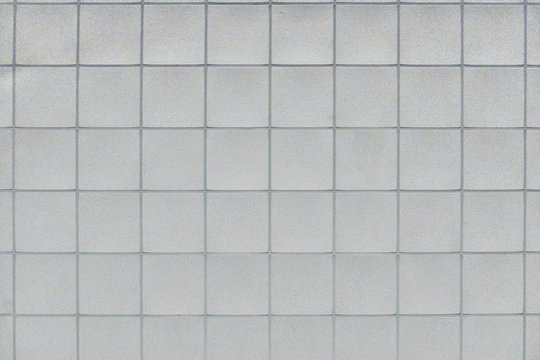 Background of the ceiling trim panels in the office. The texture of a standard panel ceiling in a building of flat squares.