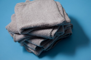 Pile of grey facecloths