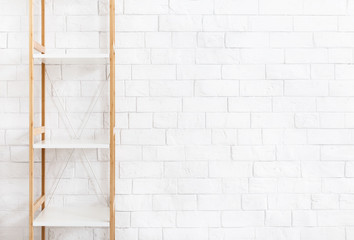 White wooden rack on white brick wall background