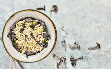 black chanterelle risotto. Black Trumpet mushrooms recipe. Italian food. 