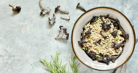 black chanterelle risotto. Black Trumpet mushrooms recipe. Italian food. 