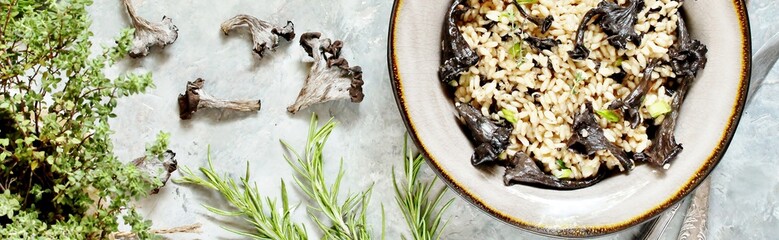 black chanterelle risotto. Black Trumpet mushrooms recipe. Italian food. 