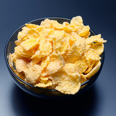 yellow corn flakes in a bowl.