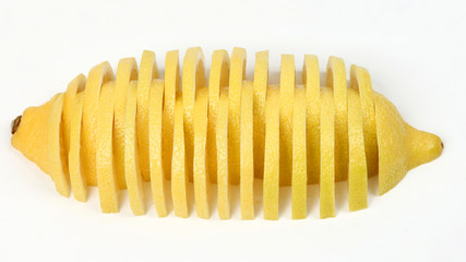 cut into long slices a lemon on a white background