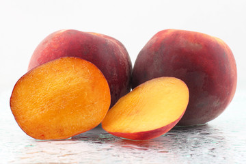 two ripe peach on a white background