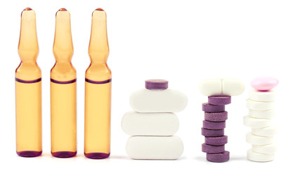 medicinal tablets, ampules for injections on white background
