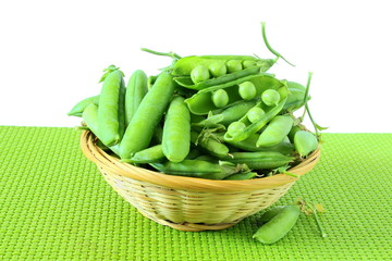 fresh open green pea pods and green peas isolated on the white background