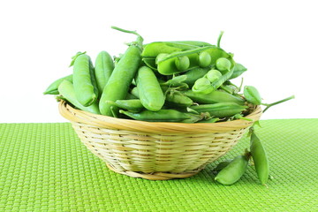 fresh open green pea pods and green peas isolated on the white background