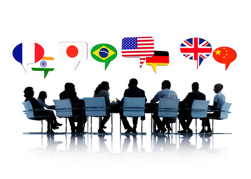 Silhouette of people in a meeting talking about different countries