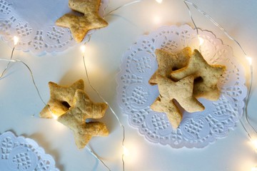 Tasty sweet gingerbread star cookies on the white.