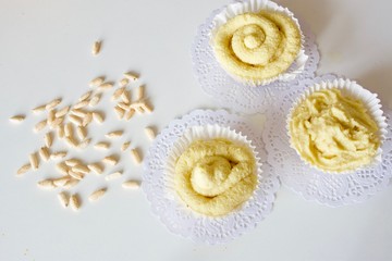 Tasty yellow pineapple cupcakes on the white table