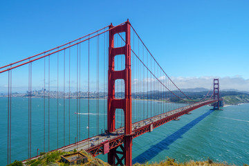 Fototapeta na wymiar Famous Golden Gate Bridge. Suspension bridge spanning the Golden Gate. The structure links the American city of San Francisco, California, the northern tip of the San Francisco Peninsula to Marin C