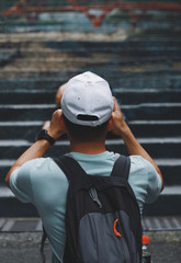 Travel man with backpack turn back.