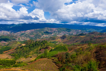 Fototapeta premium Aerial view of forest destroyed by agriculture of shifting cultivation on mountains.