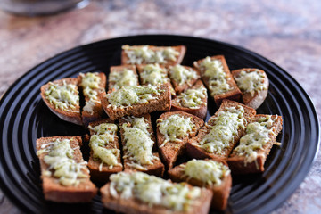Bread from the oven with seasonings. Cooking delicacies for guests