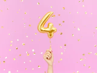 Fotobehang Four year birthday. Female hand holding Number 4 foil balloon. Four-year anniversary background. 3d rendering © vpanteon