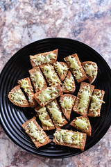 Bread from the oven with seasonings. Cooking delicacies for guests