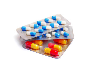 various capsules in blister packs isolated on white background