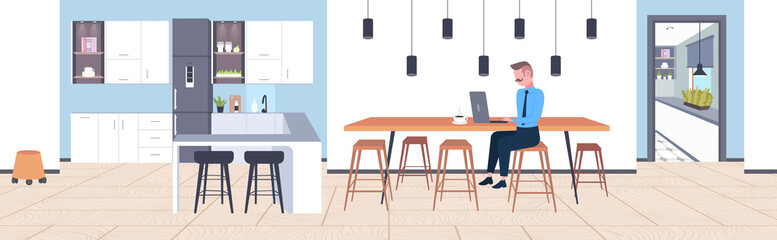 businessman sitting at cafe table business man using laptop working process concept modern coffee point kitchen interior flat full length horizontal