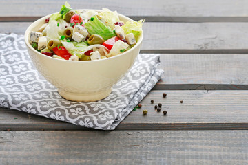 Vegetable salad with tomato, cheese and olives.