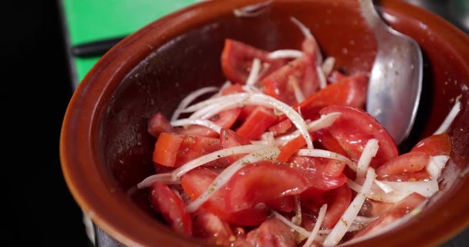 Tomato And Onions Salad Being Done Mixed With A Spoon - 4K 30fps